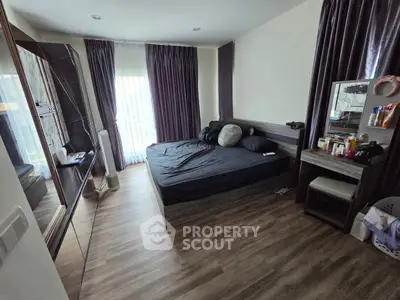 Modern bedroom with sleek design and ample natural light