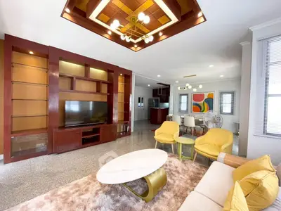 Spacious modern living room with elegant built-in shelving and stylish furniture