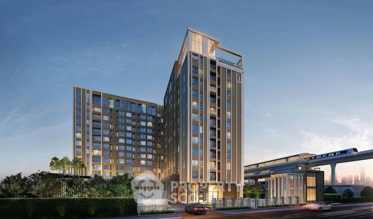 Modern high-rise building with sleek design near public transportation, ideal for urban living.