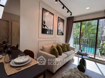 Stylish living room with pool view and elegant decor in modern apartment