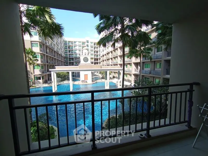 Luxurious apartment view overlooking a stunning pool and modern architecture