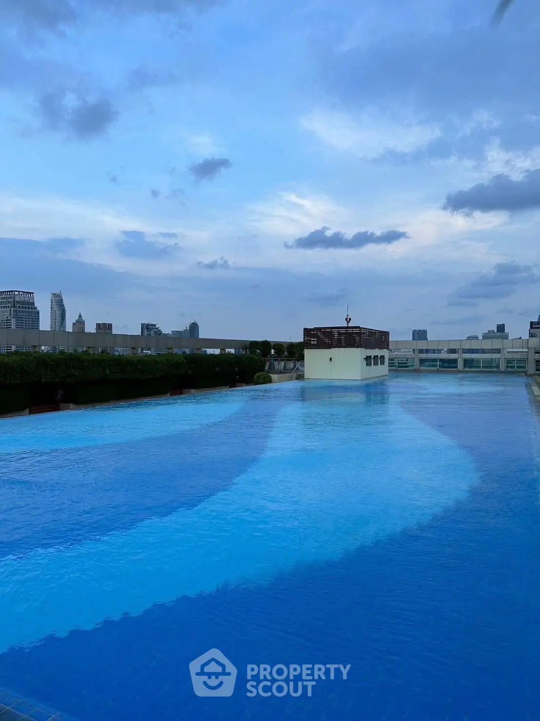 Stunning rooftop pool with city skyline views, perfect for luxury living.