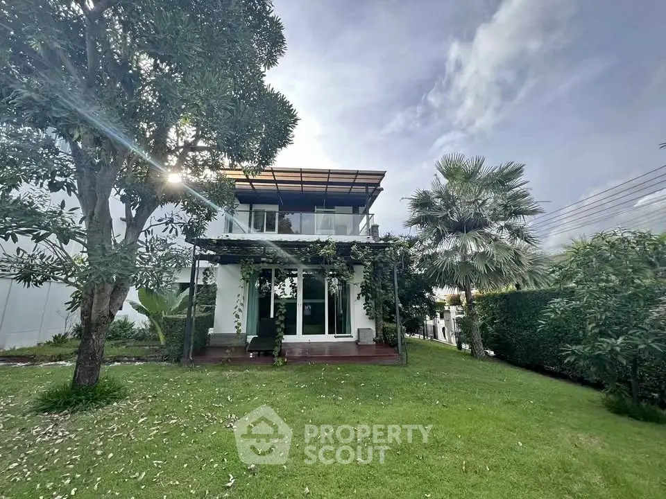 Charming two-story house with lush garden and modern design