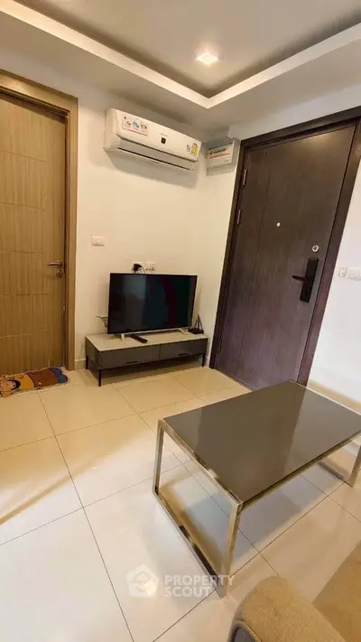 Modern living room with sleek furniture and air conditioning in a cozy apartment.