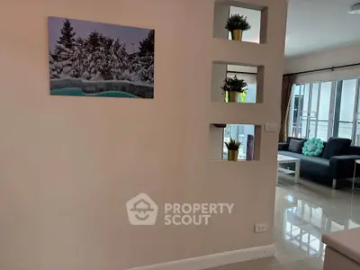 Modern living room with stylish decor and large windows for natural light.