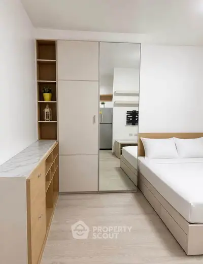 Modern bedroom with sleek wardrobe and cozy bed in minimalist design.