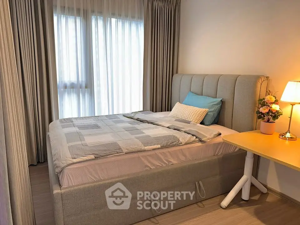 Cozy bedroom with stylish bed and soft lighting, perfect for relaxation.