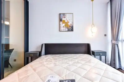 Modern bedroom with stylish decor and natural light