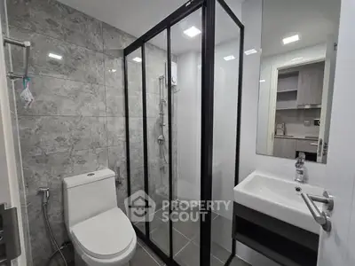 Modern bathroom with sleek shower enclosure and contemporary fixtures