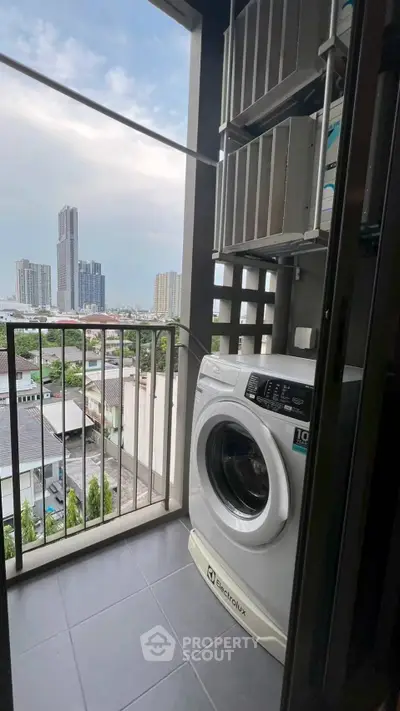 Modern balcony with washing machine and city view, perfect for urban living convenience.