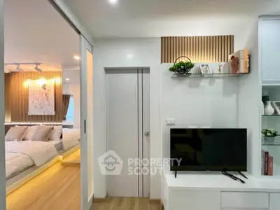Modern apartment interior with stylish living room and cozy bedroom, featuring sleek design and elegant decor.