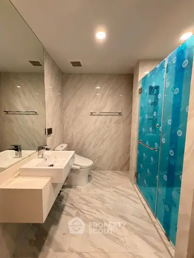 Luxurious modern bathroom with marble tiles and sleek fixtures