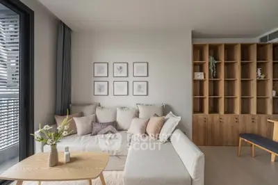 Modern living room with cozy sectional sofa and stylish wooden shelving, perfect for relaxation and entertaining.