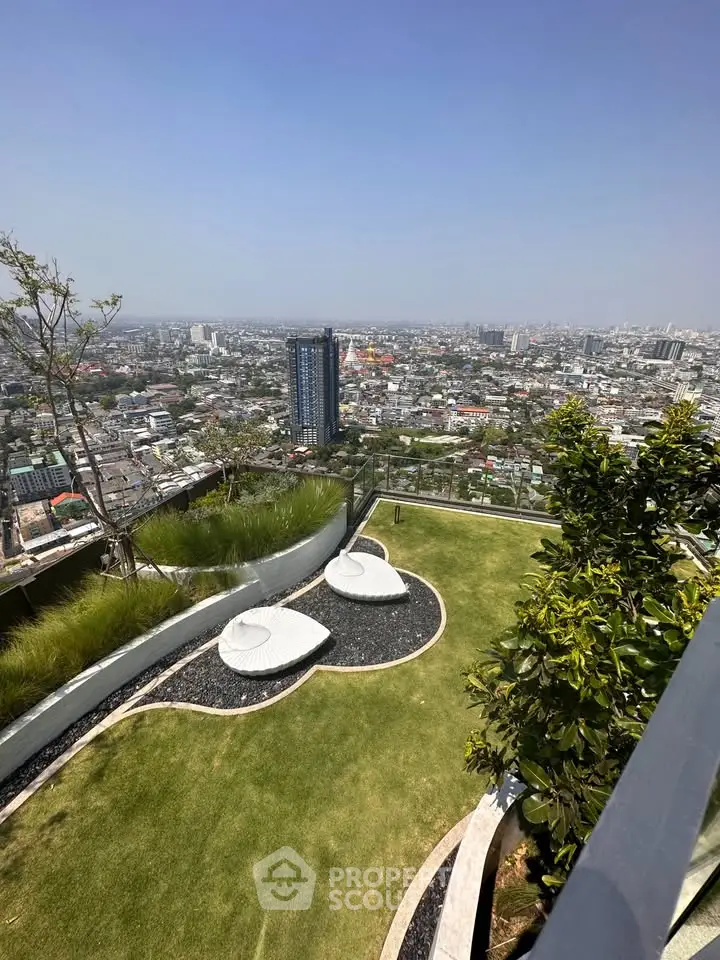 Stunning rooftop garden with panoramic city views and modern seating area.