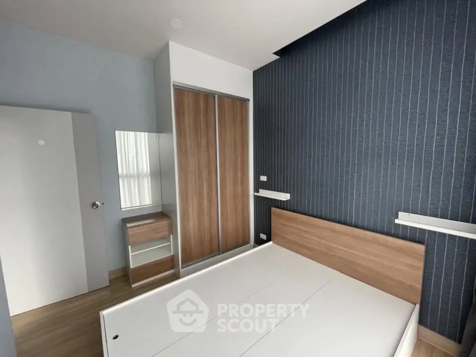 Modern bedroom with sleek wooden furniture and minimalist design