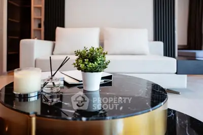 Modern living room with elegant marble coffee table and cozy sofa