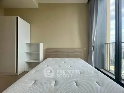 Modern bedroom with large window and city view, featuring minimalist furniture and natural light.