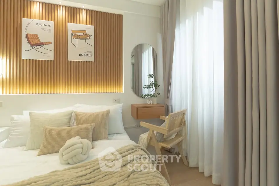 Modern bedroom with stylish decor and natural light