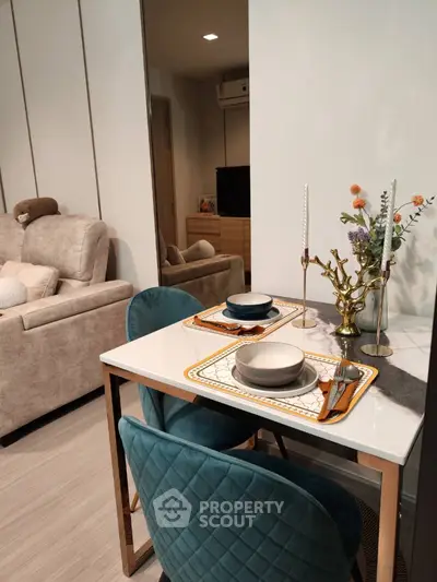 Stylish modern living room with elegant dining area and plush seating