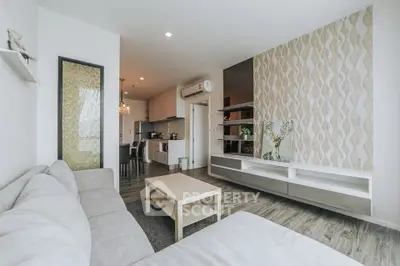 Modern living room with stylish decor and open kitchen layout in a contemporary apartment.