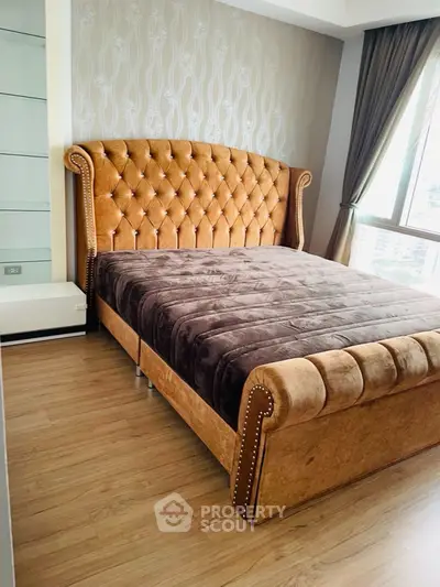 Luxurious bedroom with plush velvet bed and elegant decor