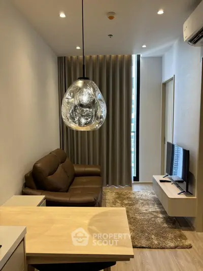 Modern living room with stylish lighting and cozy seating area