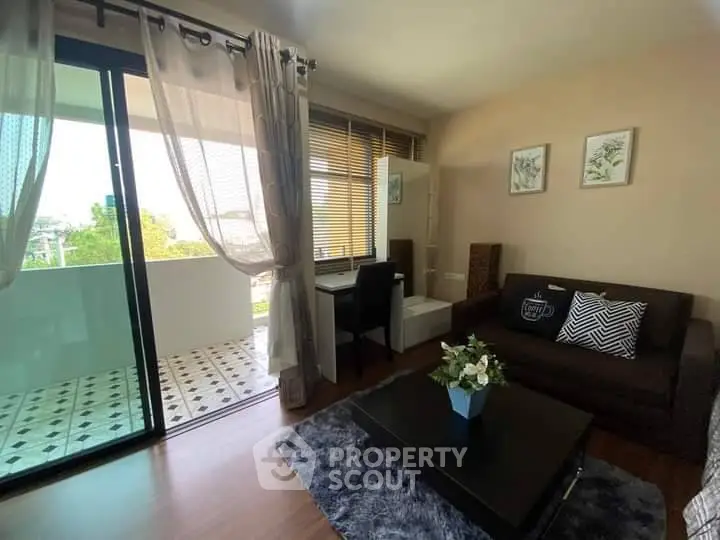 Charming living room with balcony access and stylish decor