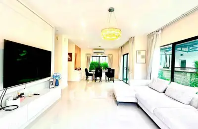 Spacious modern living room with large windows and elegant decor