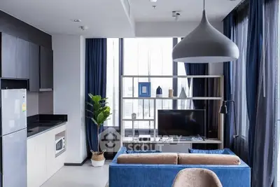 Modern living room with stylish decor, large windows, and contemporary furniture.