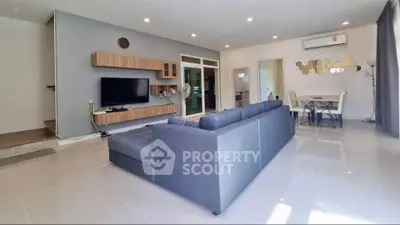 Spacious modern living room with sleek design and ample natural light