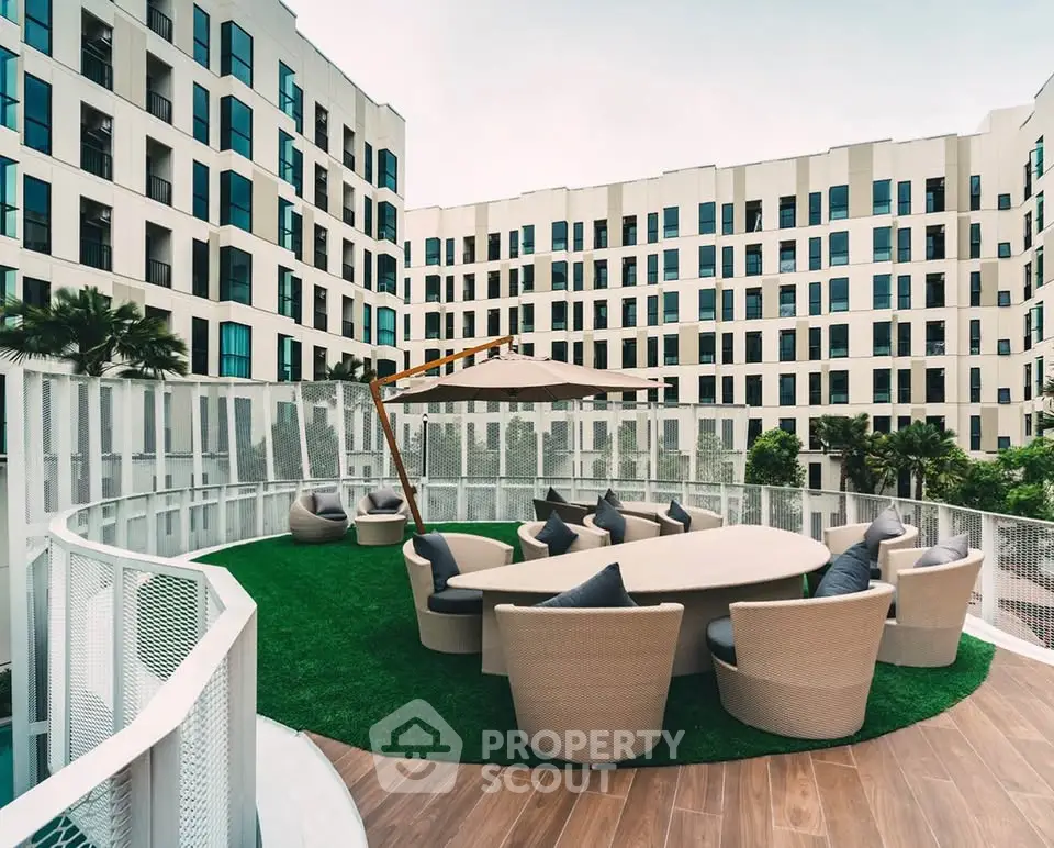 Modern building with stylish outdoor seating area and lush greenery