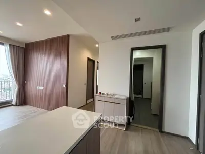 Modern apartment interior with sleek design and natural light, featuring a spacious layout and elegant finishes.
