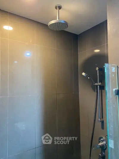 Modern bathroom with sleek shower design and elegant tile finish.