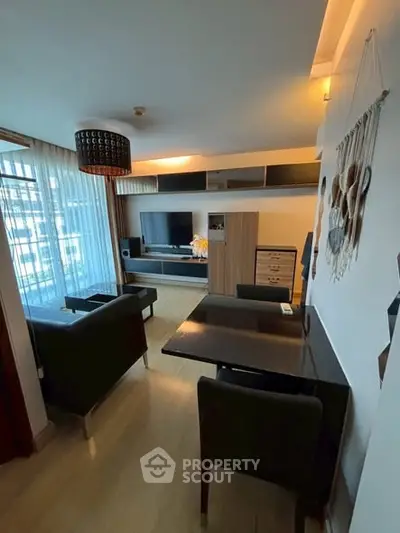 Stylish modern living room with sleek furniture and large TV setup