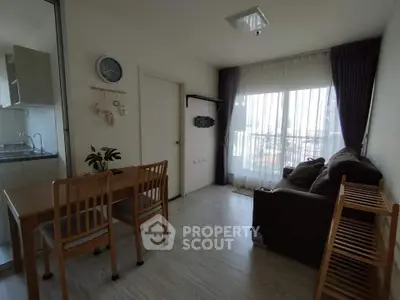 Cozy living room with dining area and large window view