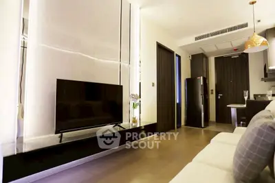 Modern living room with sleek design and open kitchen layout