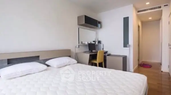 Modern bedroom with study area and minimalist decor