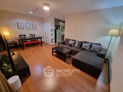 Spacious modern living room with cozy sectional sofa and dining area, perfect for entertaining.
