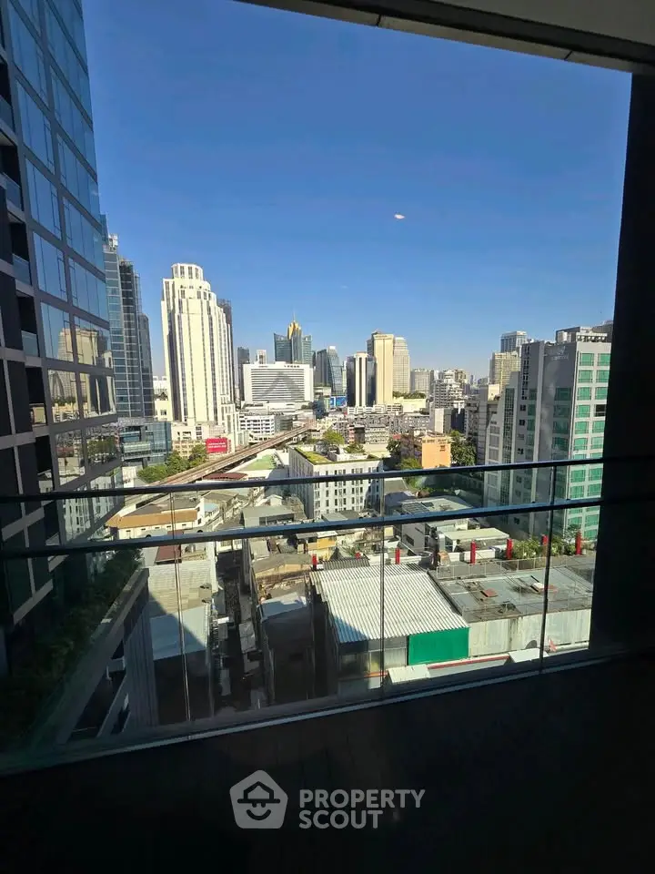 Stunning cityscape view from a modern balcony in a high-rise building.
