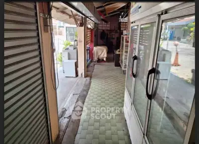 Charming commercial space with glass display and tiled flooring, ideal for small business setup.