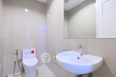 Modern bathroom with sleek fixtures and elegant tiling