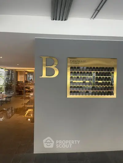 Modern building entrance with parking lot directory and stylish decor