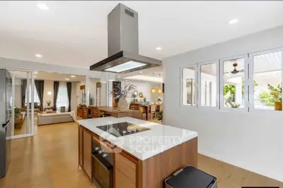Spacious modern kitchen with open layout and sleek island in a stylish home