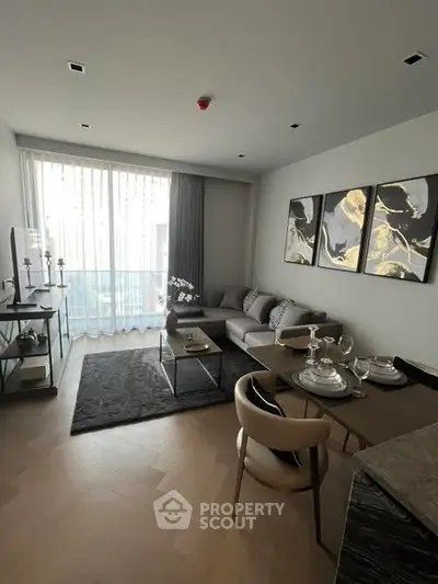 Modern living room with elegant decor and large window, perfect for urban living.