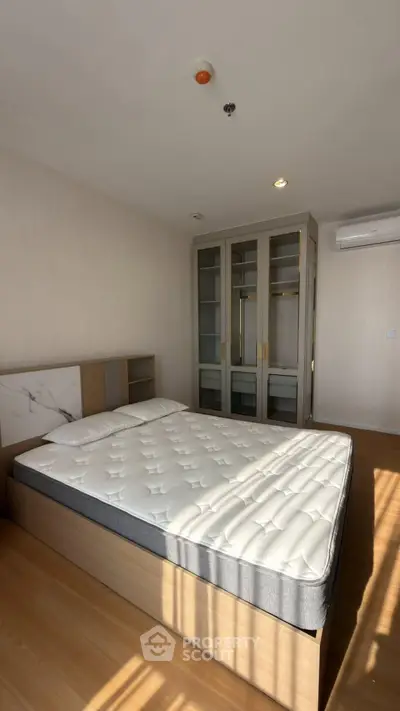 Spacious bedroom with modern design and ample natural light