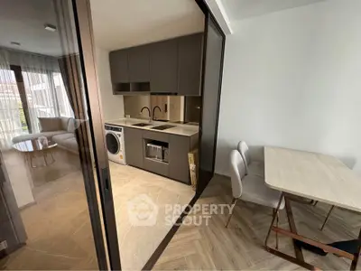 Modern kitchen with open layout and dining area in stylish apartment