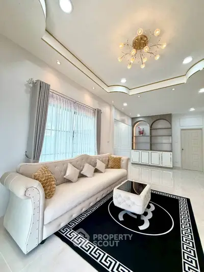 Luxurious living room with elegant sofa and modern chandelier