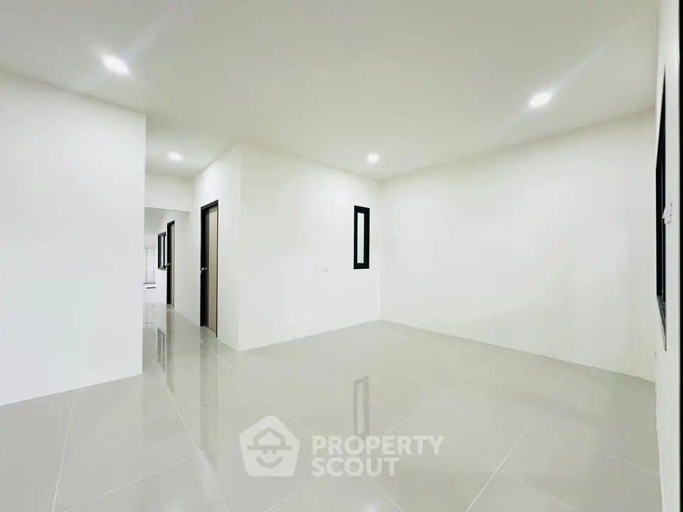 Spacious modern interior with glossy tiled floors and minimalist design, perfect for customization.