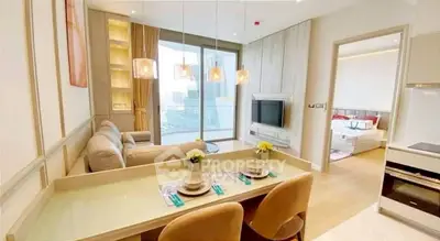 Modern open-plan living room with dining area and city view, featuring elegant decor and cozy ambiance.