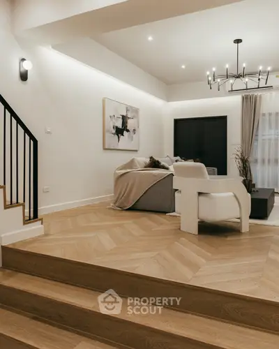 Stylish modern living room with elegant lighting and cozy seating area.